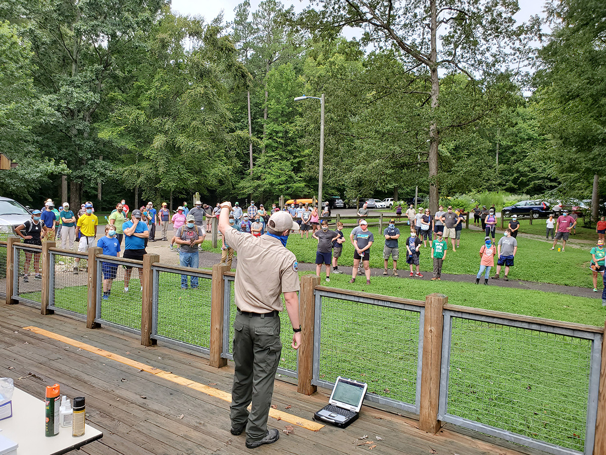 staff give instructions to volunteers