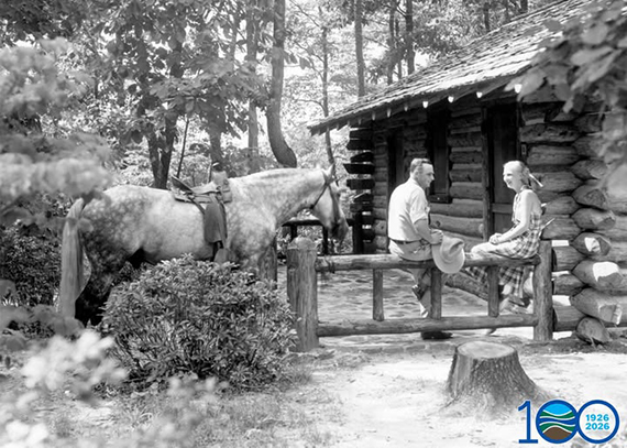 Couple at a cabin with a horse. circa 1937